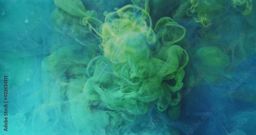 Ink water mix. Colorful mist flow. Smoke cloud animation. Blue green fluid drop infusion spreading motion on blur abstract background. Ink water mix. Colorful mist flow. Smoke cloud animation. Blue green fluid drop infusion spreading motion on blur abstract background.