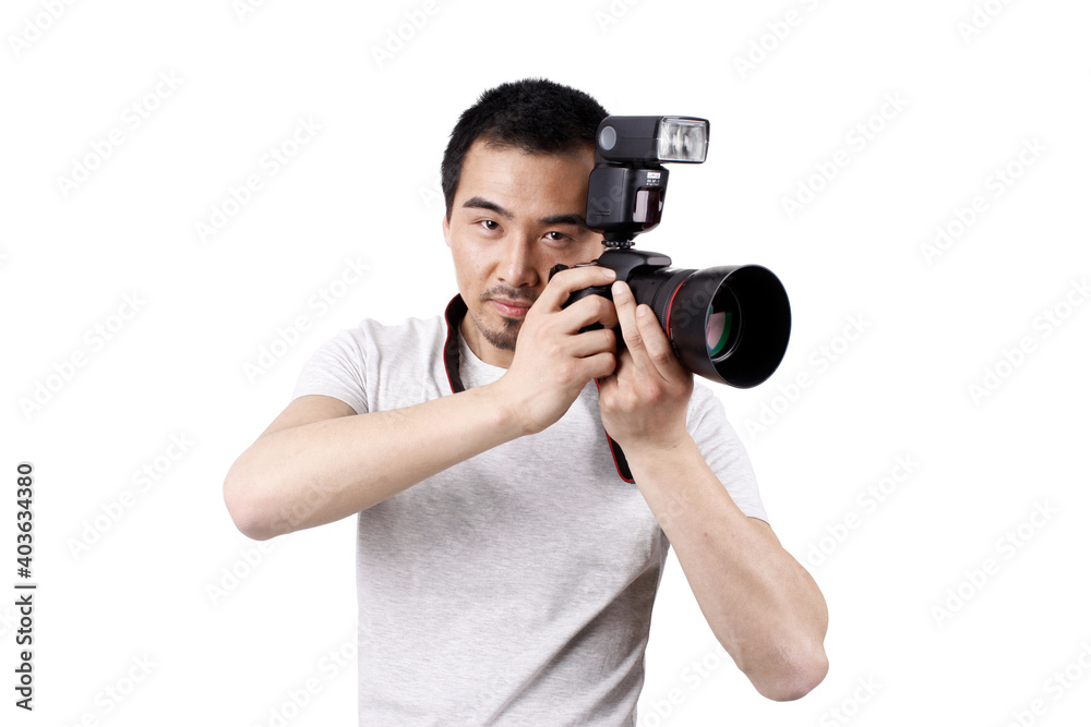 A young male photographer with a camera A young male photographer with a camera