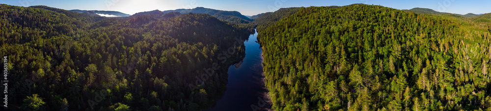 Naklejka premium Beautiful drone 180 degree panorama photo of the Ouareau river. On a bright sunny day.