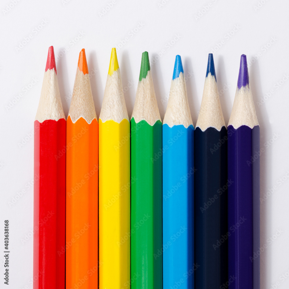 Multi-colored pencils on a white background. Multi-colored pencils on a white background.