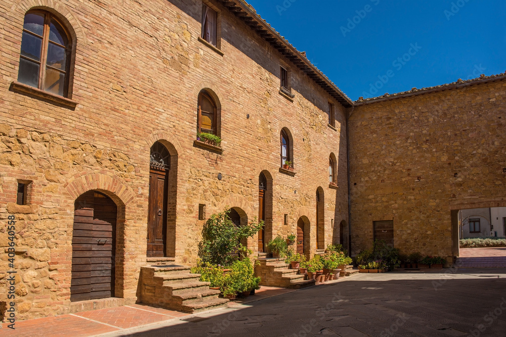 An historic stone residential building in the village of Pienza in Siena Province, Tuscany, Italy
