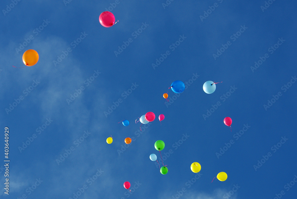 colorful balloons on a blue sky background colorful balloons on a blue sky background