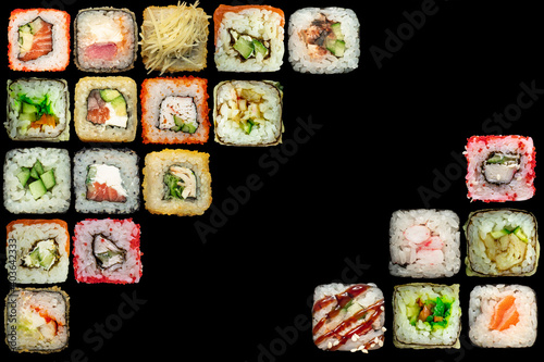 Set of seafood - isolated rolls on black background.