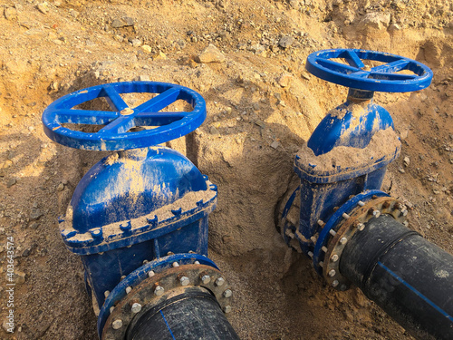 Wallpaper Mural Valves on pipeline in ground. Pipe valves in trench Torontodigital.ca