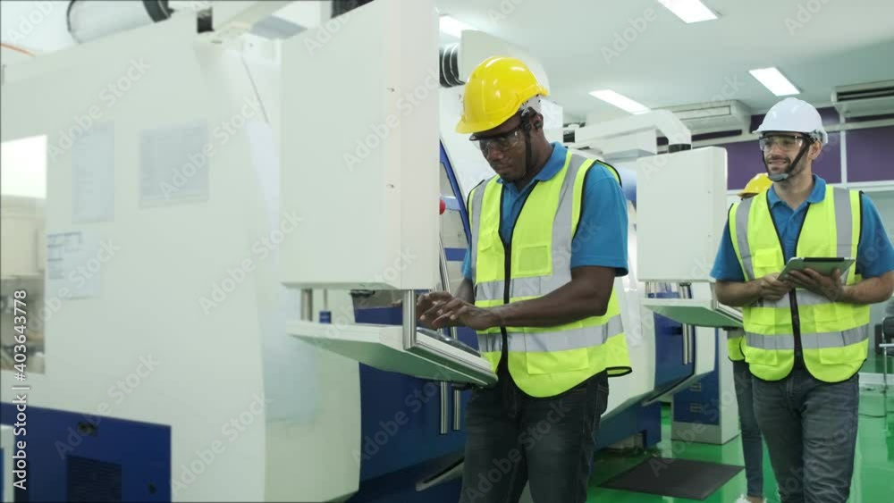 factory worker man and worker woman training about operating machine with one point to monitor,checking machine in factory.management system to support industrial business working concept factory worker man and worker woman training about operating machine with one point to monitor,checking machine in factory.management system to support industrial business working concept