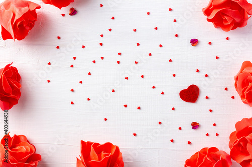 White wood festive frame for St Valentine day, 8 march, woman day. Romantic composition with red hearts and foamiran roses for lovers day. photo