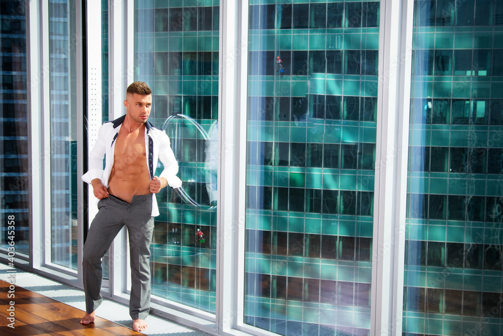 Young attractive businessman is resting at home. Handsome man in the apartment. Young attractive businessman is resting at home. Handsome man in the apartment.