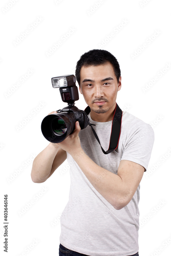 A young male photographer with a camera A young male photographer with a camera