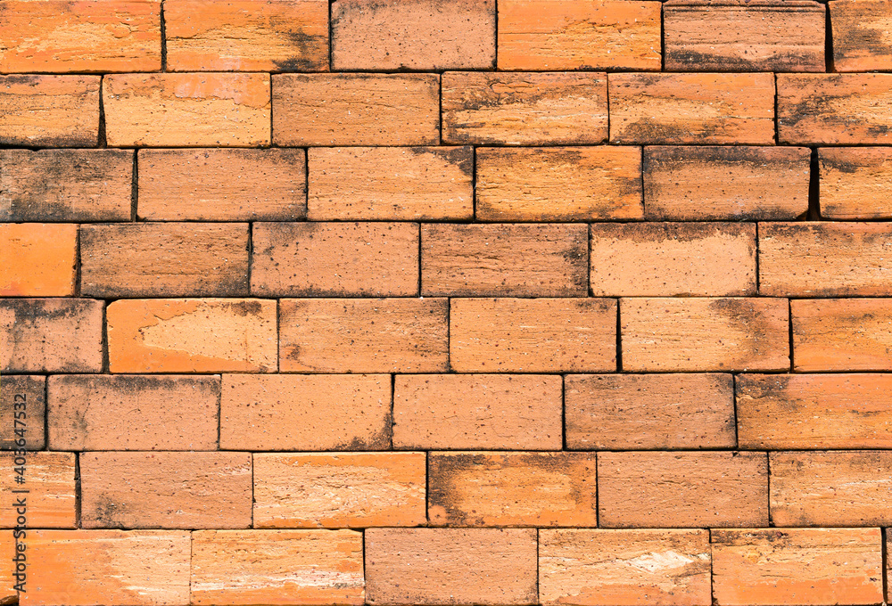 Obraz premium Orange color brick wall for brickwork background design
