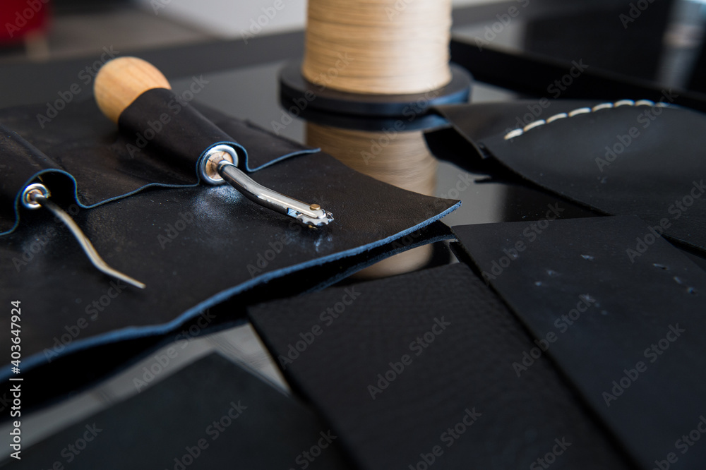 A leather craftsman works with leather. Sews leather goods. Use needle and thread for sewing. Making things handmade.. A leather craftsman works with leather. Sews leather goods. Use needle and thread for sewing. Making things handmade..