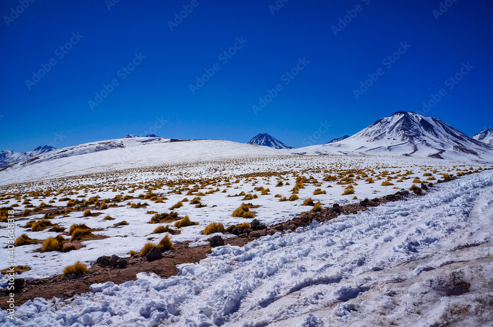 Winter view of snow-capped mountains near Laguna Miscanti, Antofagasta, Chile