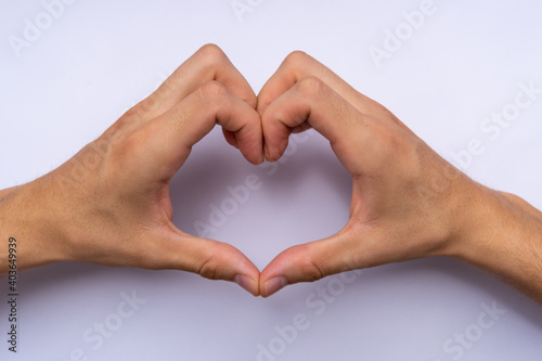 man s hands forming a heart  valentine s day