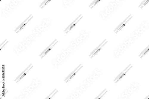 Medical syringes seamless pattern. Medical syringes on a white background.