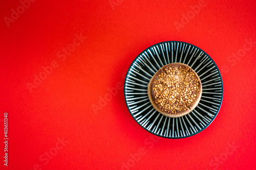 a traditional Christmas polvoron sweet on a small ceramic dish photo