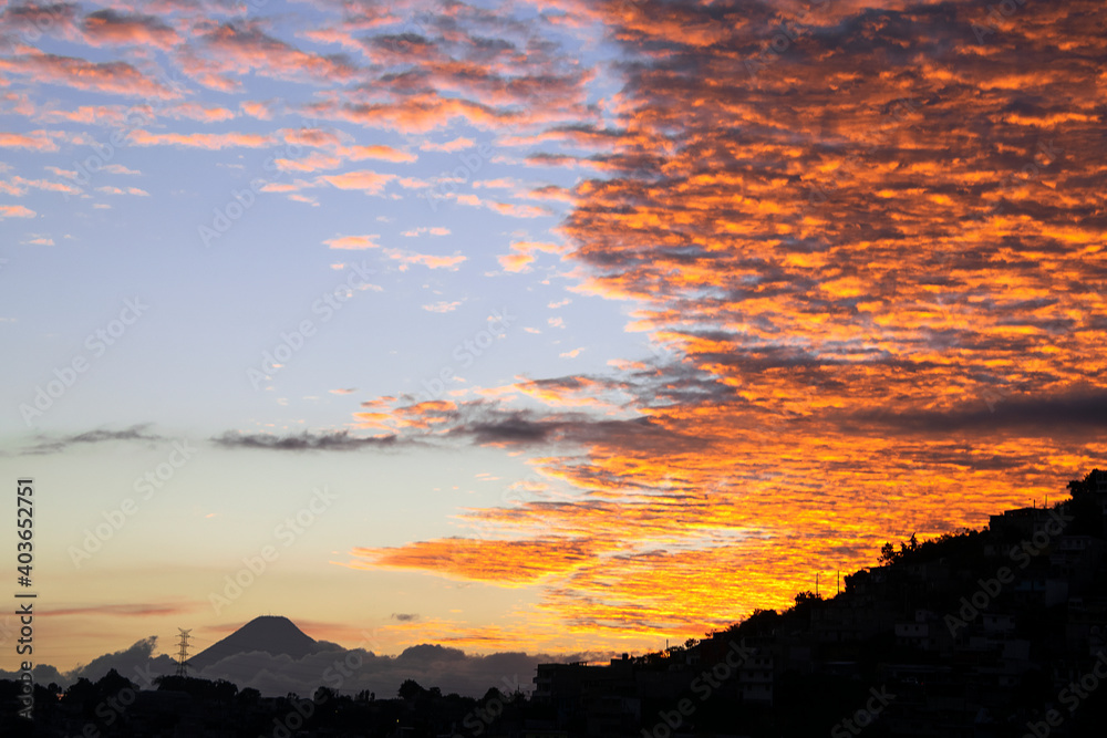 Mountain silhouette in overpopulated area of Guatemala at sunset, zone 18 area with the largest urban population in Central America.