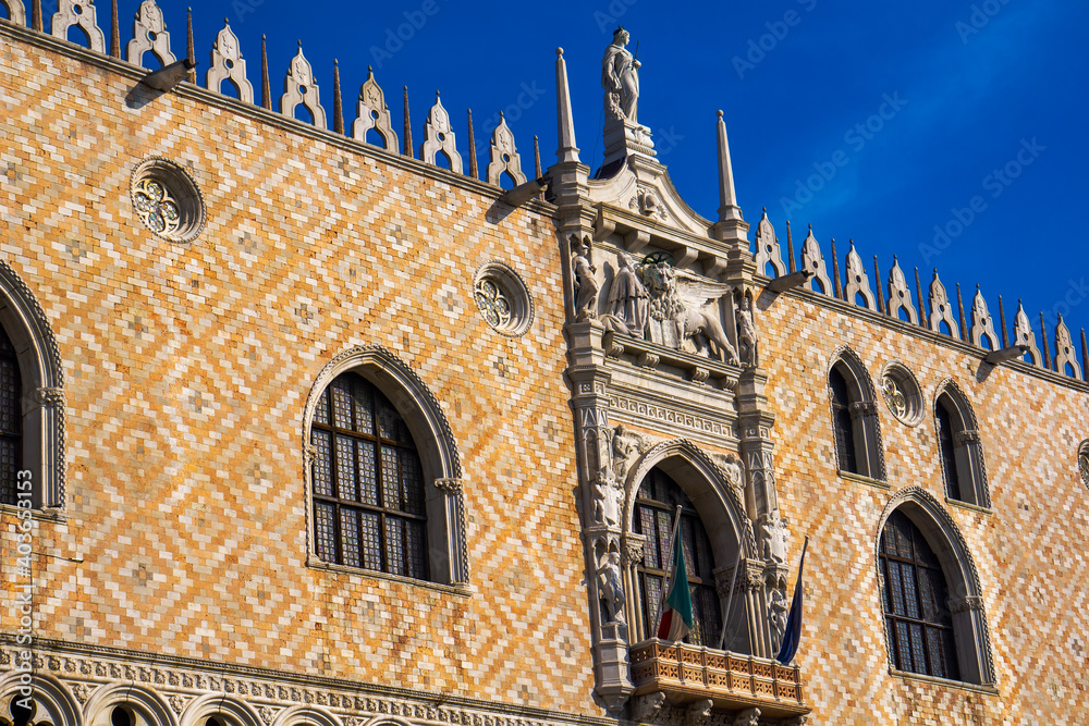 Ornate facade at southern side of Doge Palace on San Marco square in Venice, Italy
