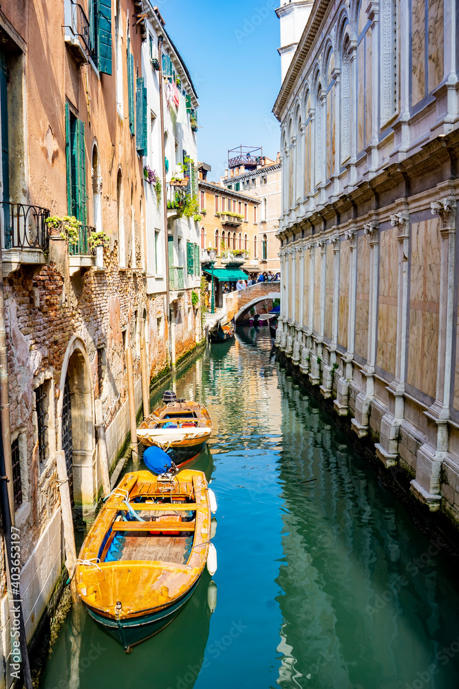Boats at narrow canal in Venice, Italy
