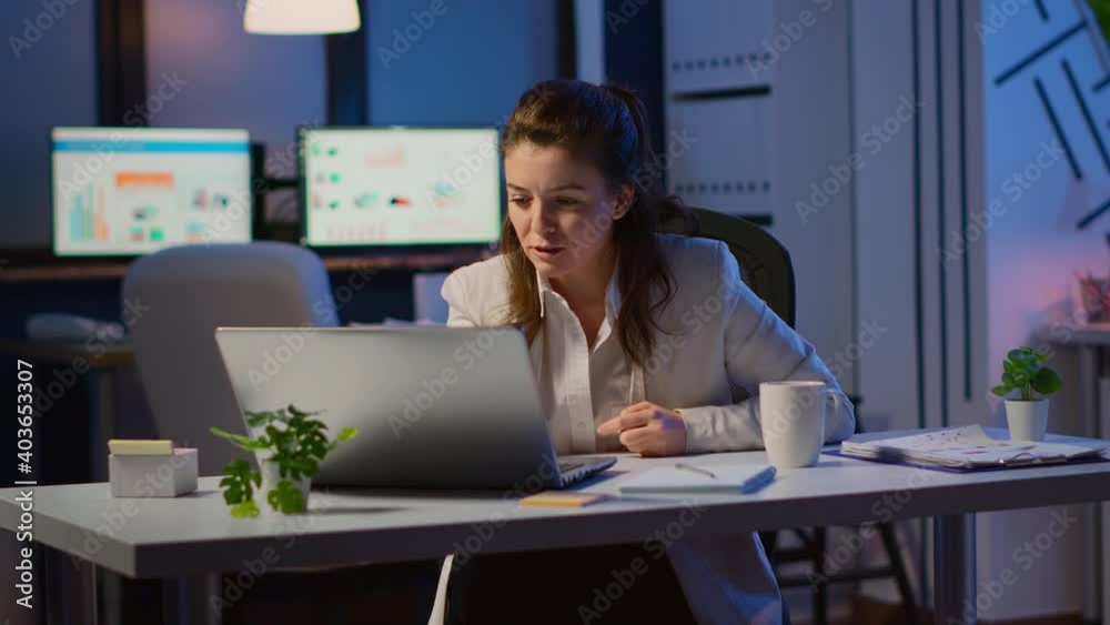 Excited young woman winner looking at laptop celebrate online win success reading great news using laptop feel amazed working overtime in start up business office. Employee using technology network Excited young woman winner looking at laptop celebrate online win success reading great news using laptop feel amazed working overtime in start up business office. Employee using technology network