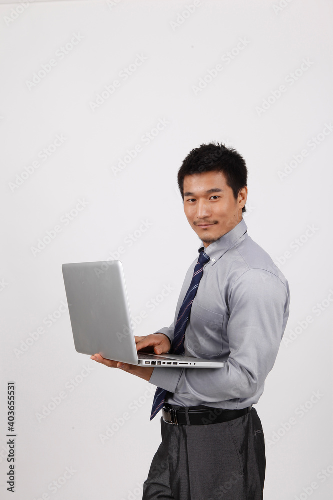 A young business man using a laptop A young business man using a laptop