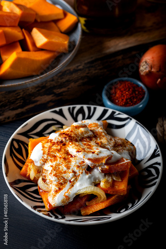 Quadro su tela Traditional Aegean meal Sinkonta is made with pumpkin on the dark background