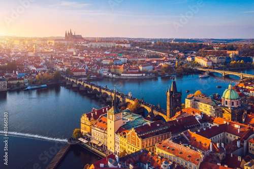 Aerial Prague panoramic drone view of the city of Prague at the Old Town Square, Czechia. Prague Old Town pier architecture and Charles Bridge over Vltava river in Prague at sunset, Czech Republic. © daliu