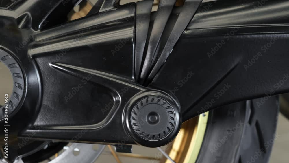 Closeup of rear wheel hub and brake disc of a modern motorcycle. Cinematic shot Closeup of rear wheel hub and brake disc of a modern motorcycle. Cinematic shot
