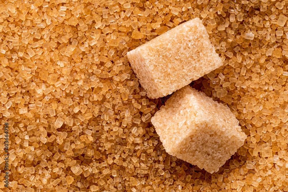 Brown sugar cubes and granulated sugar. Brown sugar cubes and granulated sugar.