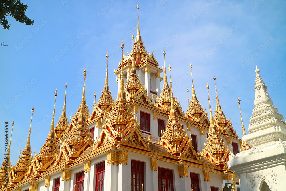 Fototapeta premium Spectacular Golden Spires of the Historic Loha Prasat (Iron Castle) inside Wat Ratchanatdaram Temple Located in Bangkok Old City, Thailand