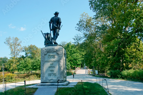 Minuteman statue in north bridge of minute man national historical park MA USA photo