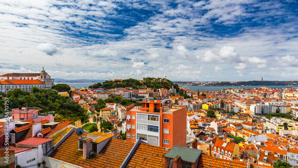 Lisbon, Portugal skyline with Sao Jorge Castle. Panoramic aerial view of Lisbon, Portugal. Panorama view of old town Lisbon and Sao Jorge Castle, the capital and the largest city of Portugal.