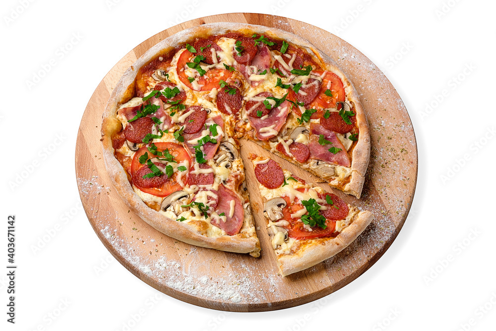 Whole Pizza with salami slices, tomato, mozzarella cheese and fresh greens on top. Served on wooden plate served with culinary flour and spices, isolated on white background
