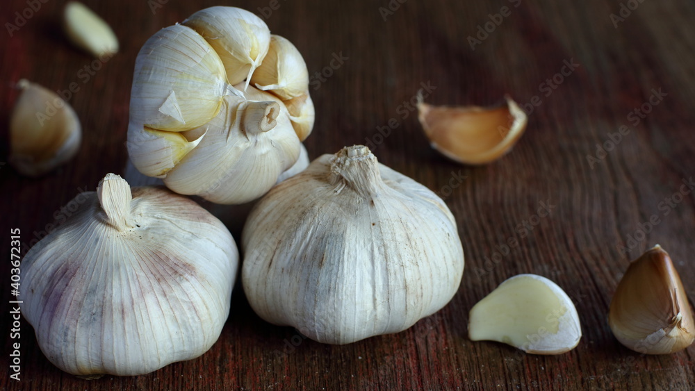 Garlic on old wooden background