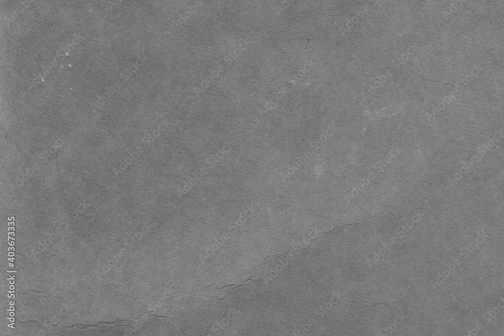 Fototapeta premium Cardboard black abstract texture close-up. Dark old paper background. Grunge concrete wall. Vintage blank wallpaper.