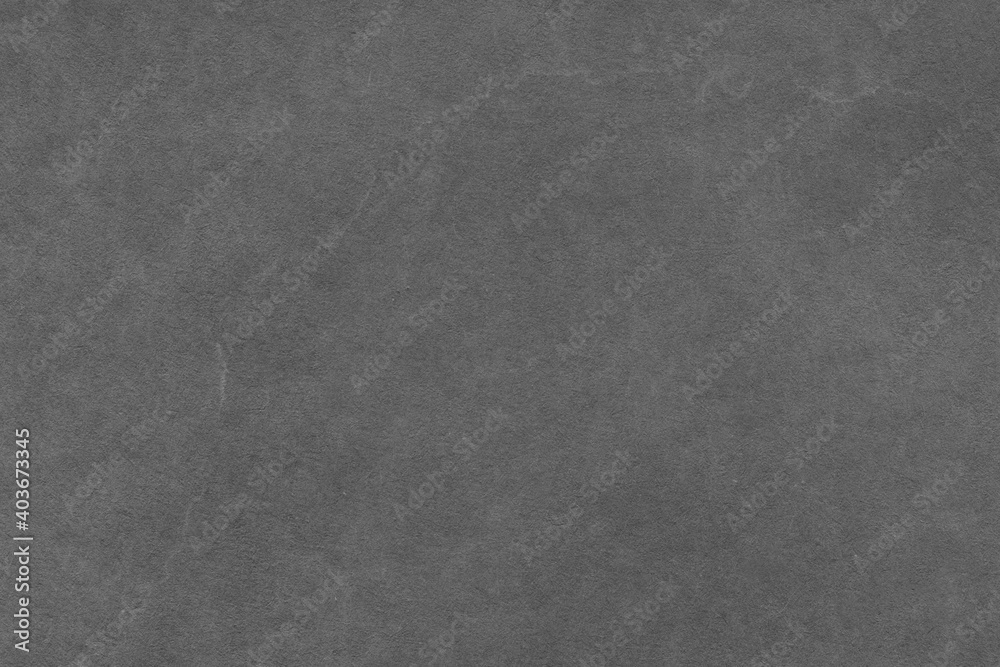 Fototapeta premium Cardboard black abstract texture close-up. Dark old paper background. Grunge concrete wall. Vintage blank wallpaper.