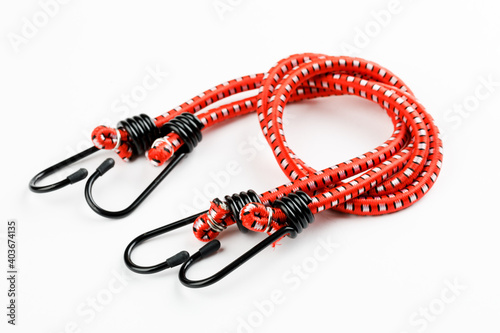 Elastic rubber rope with hook on the end on a white background