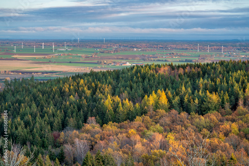Late autumn color scene with low casting light over horizon landscape of forests and fields harvested fields. Magnificent view from mountain Omberg in East of Sweden. photo