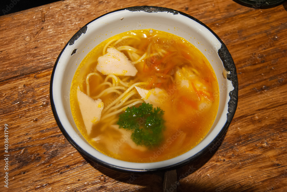 Homemade Russian noodle and chicken soup served in a Soviet era enameled bowl, Saint Petersburg, Russia Homemade Russian noodle and chicken soup served in a Soviet era enameled bowl, Saint Petersburg, Russia
