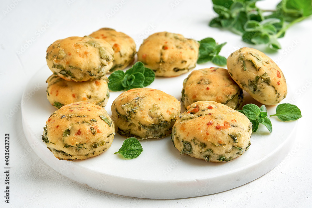 Homemade buns with fresh herbs and cheese. Top view with copy