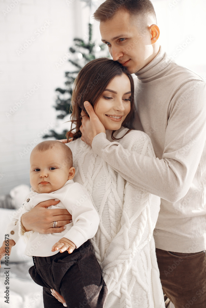 People preparing for Christmas. People by the Christmas tree. Family is resting in a festive room. People preparing for Christmas. People by the Christmas tree. Family is resting in a festive room.