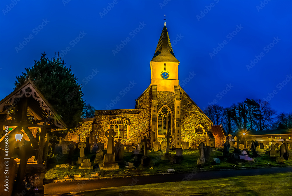 A medieval church and cemetery at night in Sanderstead, Croydon, UK in winter A medieval church and cemetery at night in Sanderstead, Croydon, UK in winter