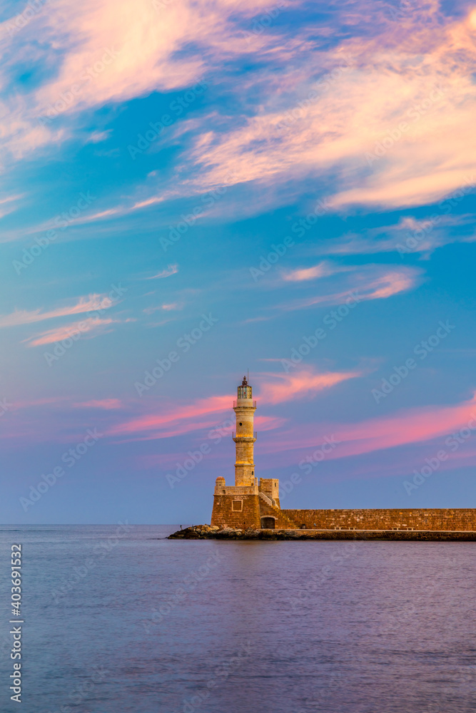Venetian harbour and lighthouse in old harbour of Chania at sunrise, Crete, Greece. Old venetian lighthouse in Chania, Greece. Lighthouse of the old Venetian port in Chania, Greece.