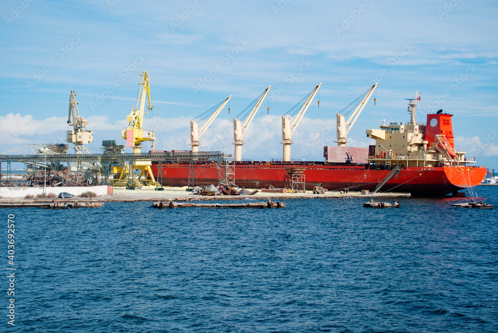 An empty cargo ship stands for loading containers for import.
