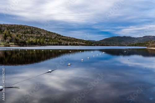 Reflection on the calm side of the pond. Barachois Pond Provincial Park, Newfoundland, Canada photo