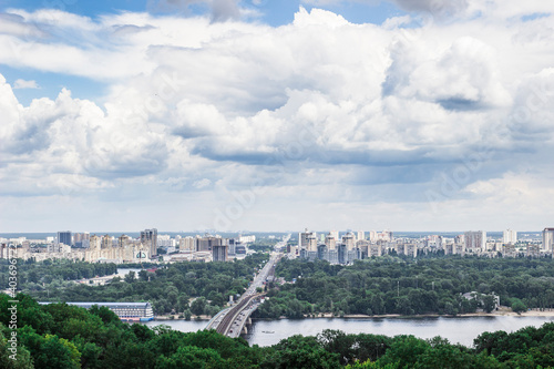 huge clouds over skyscrapers and parks in the city of Kiev
