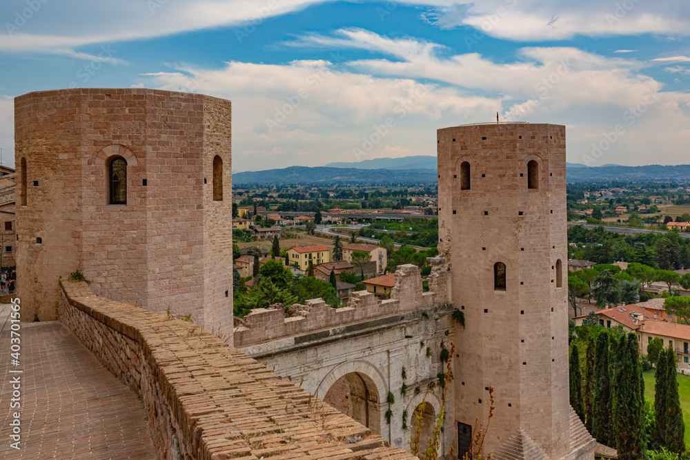 Narrow alleys and ancient medieval buildings in the picturesque town of Spello, in Umbria (Italy)