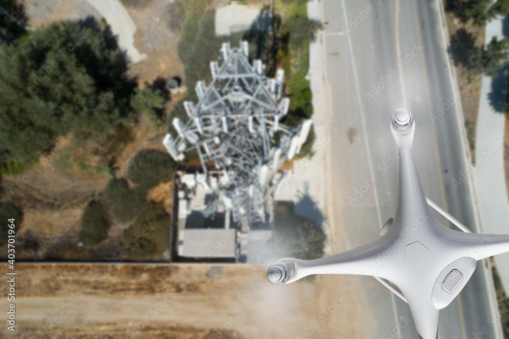 Unmanned Aircraft Drone Flying Near and Inspecting Cell Tower