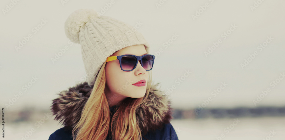 Portrait of beautiful young blonde woman wearing a hat outdoors Portrait of beautiful young blonde woman wearing a hat outdoors