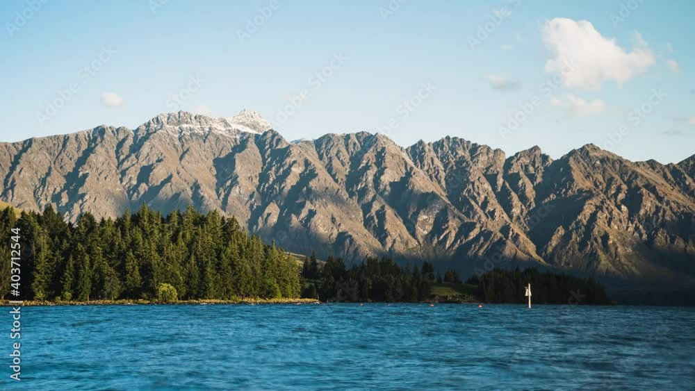 Mountain range with a lake timelapse at sunset - Remarkables, Queestown Mountain range with a lake timelapse at sunset - Remarkables, Queestown