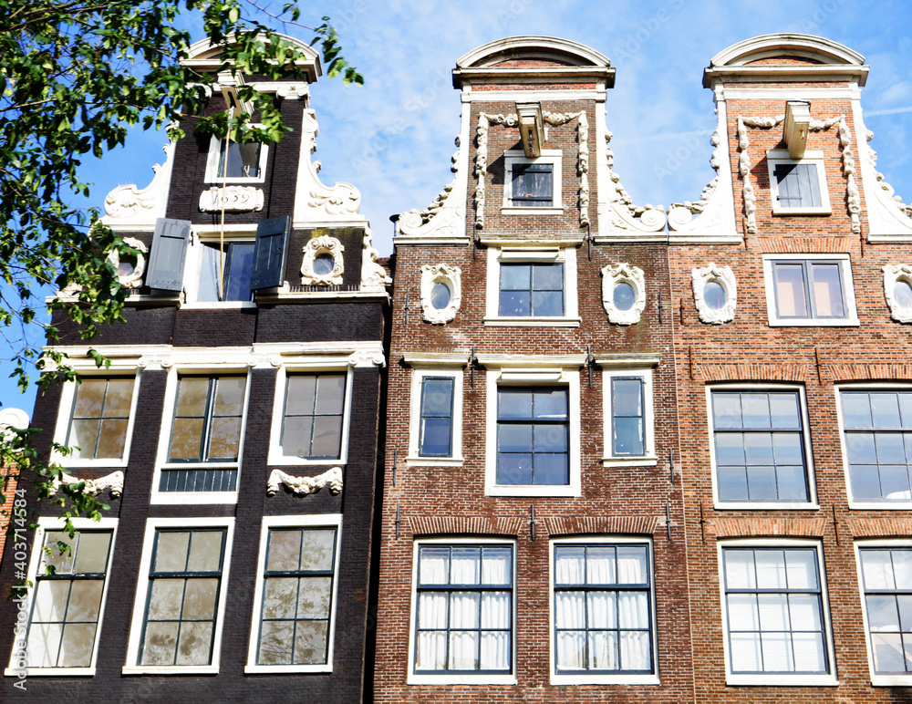 Fototapeta premium Typical Amsterdam houses summer day