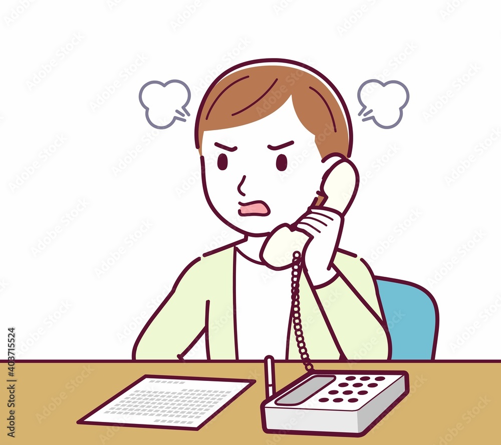 Young woman in a cardigan_Fixed-line phone Young woman in a cardigan_Fixed-line phone